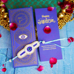 Handcrafted Evil Eye Beaded Rakhi with Dual Panel Design and Satin Ties in Aqua Blue