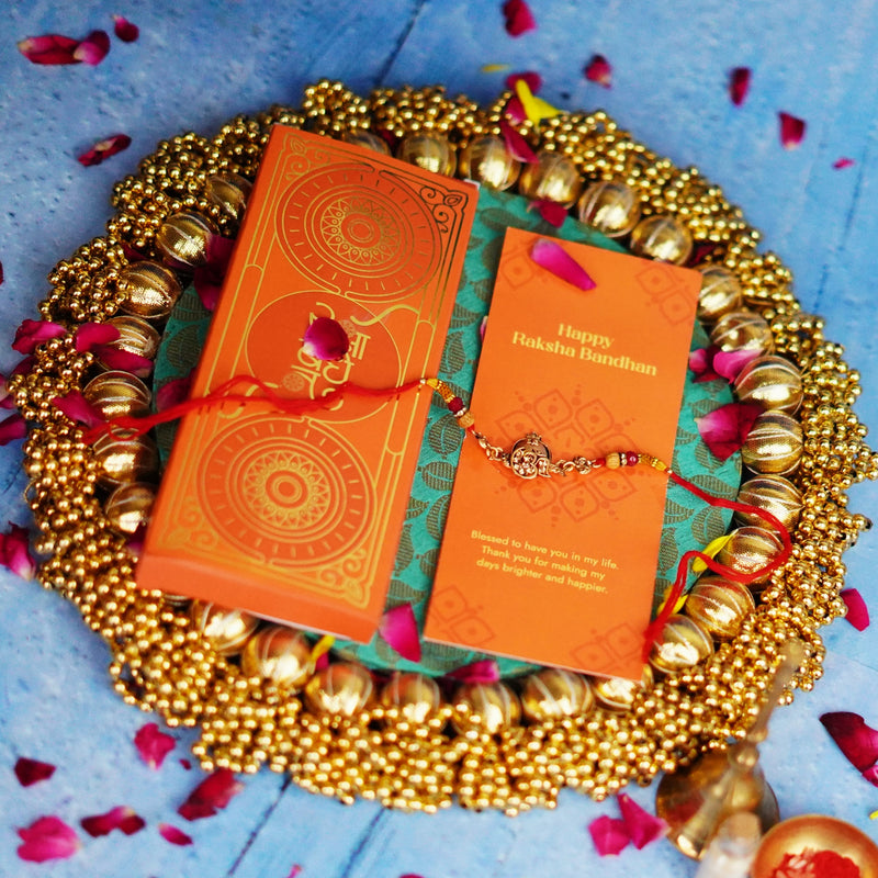 Ethnic Red Drop Bead & Om Rakhi with Metal Finish