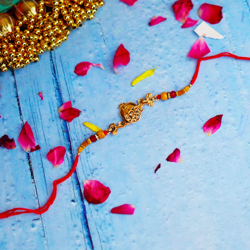 Ethnic Red Drop Bead & Om Rakhi with Metal Finish