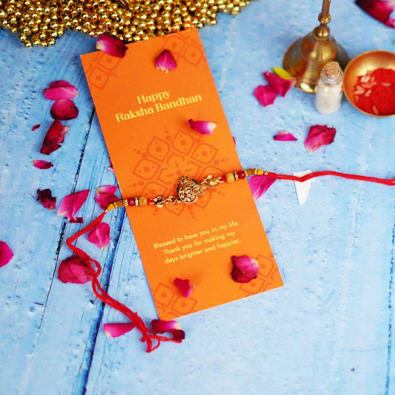 Ethnic Red Drop Bead & Om Rakhi with Metal Finish