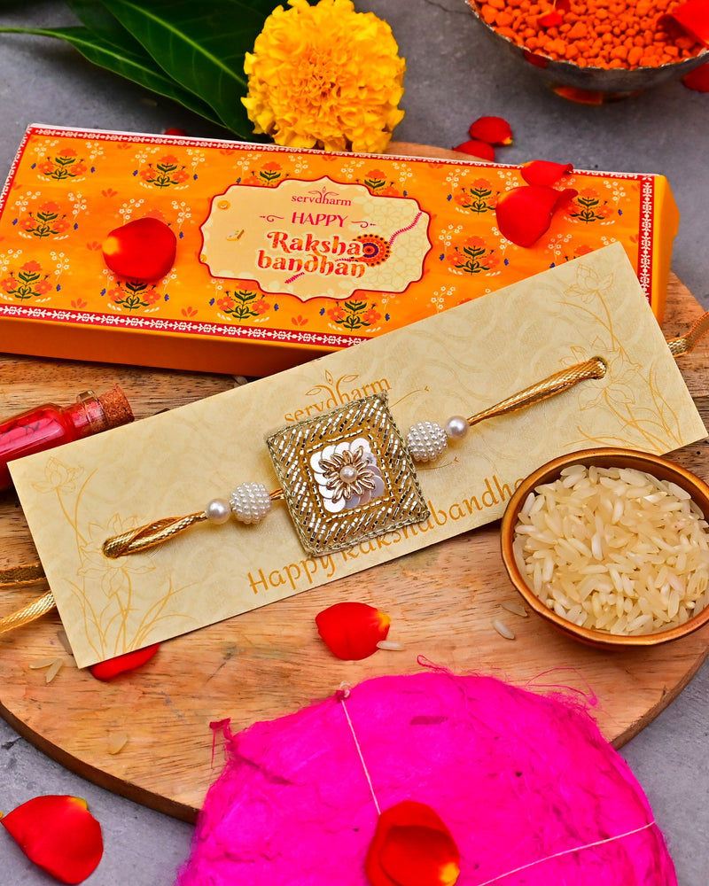 Beige and Golden Handcrafted Fabric Rakhi