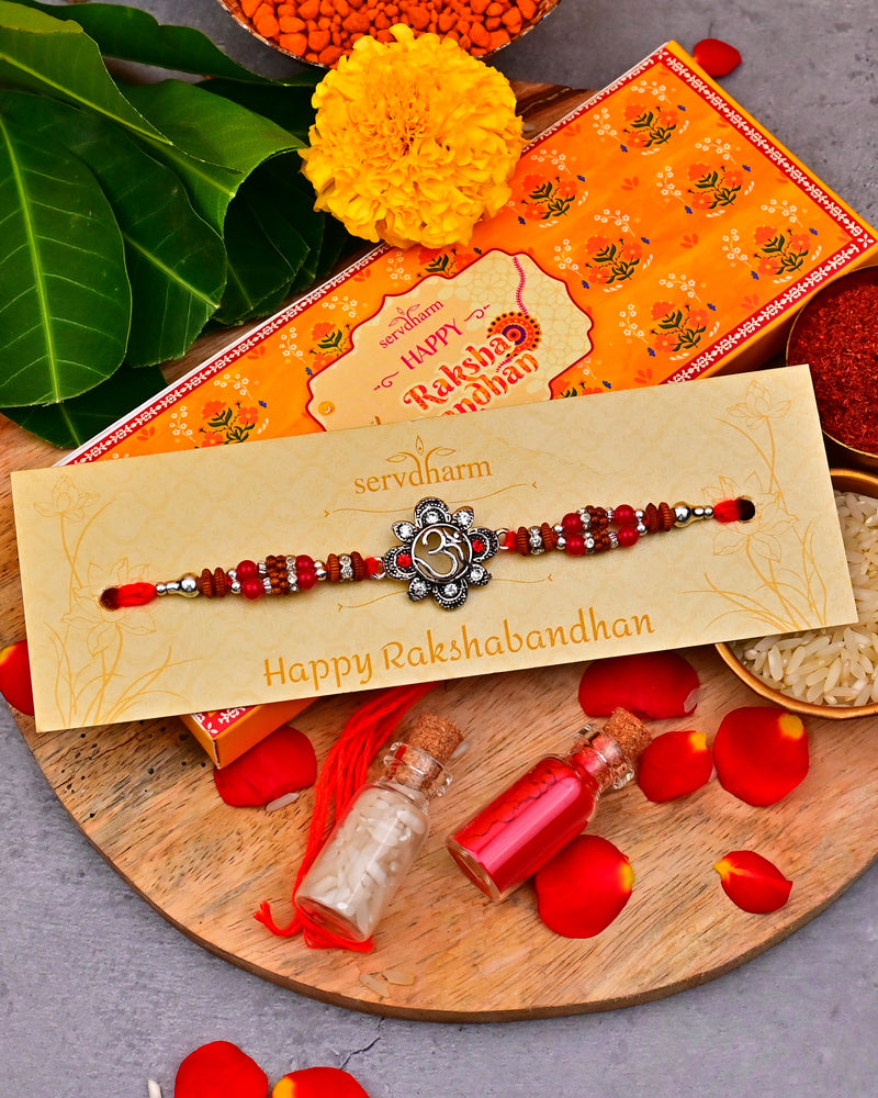 Ethnic Red Drop Bead & Om Rakhi With Metal Finish