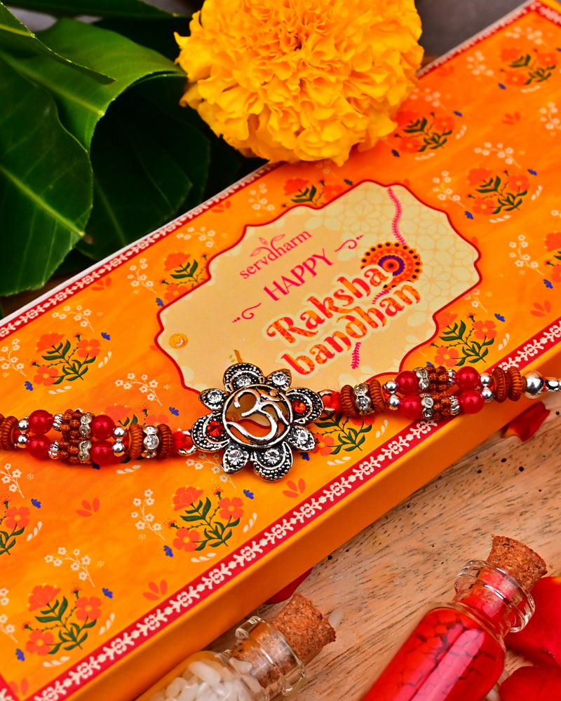 Ethnic Red Drop Bead & Om Rakhi With Metal Finish