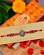 Ethnic Red Drop Bead & Om Rakhi With Metal Finish