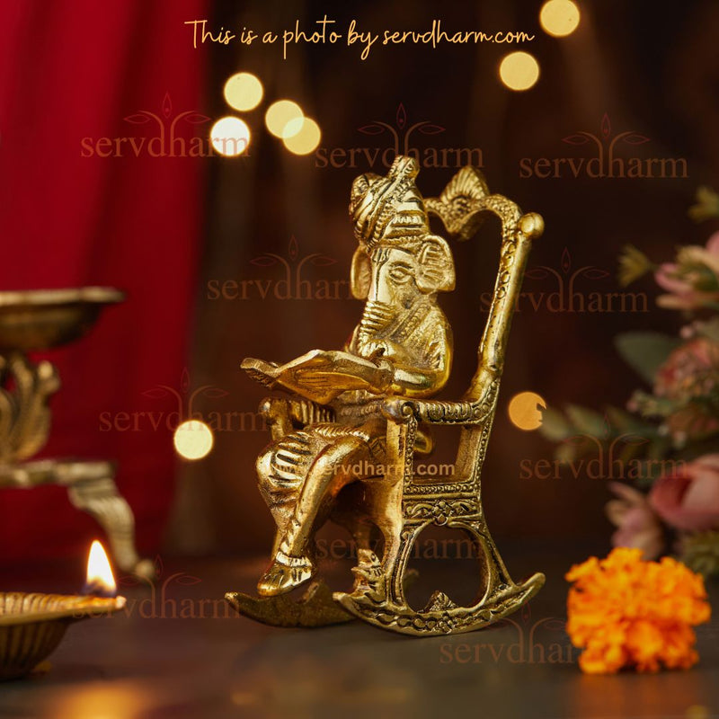 Metal Lord Ganesha Statue Reading and Sitting on Rocking Chair