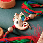 Gold Ganpati Rakhi with Multicolour Thread