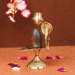 Natural Stone Narmadeshwar Shivling with Small Golden Trishul & Temple Figurine (6 Inch)